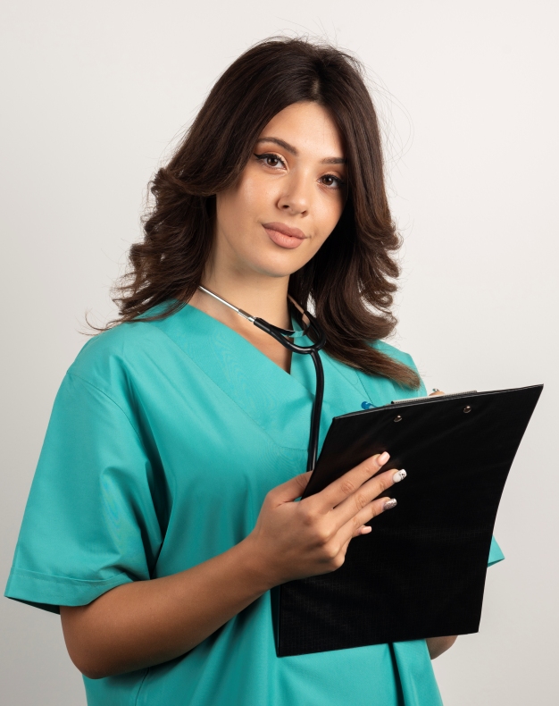 Female doctor with stethoscope and clipboard looking at camera